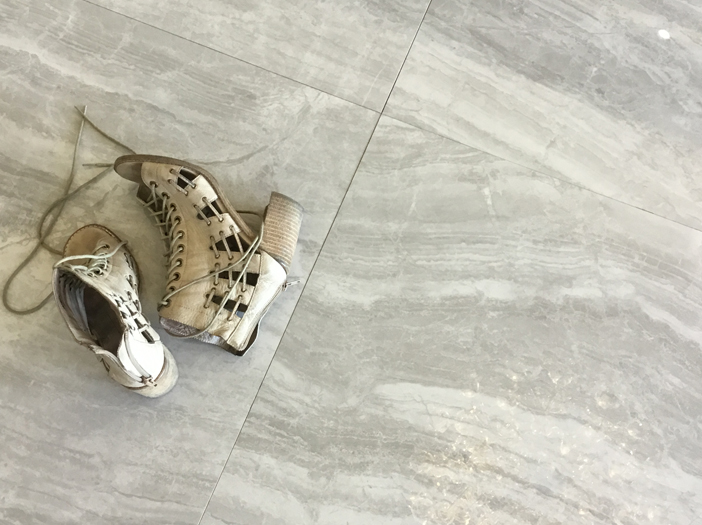 Women's shoes on marble flooring