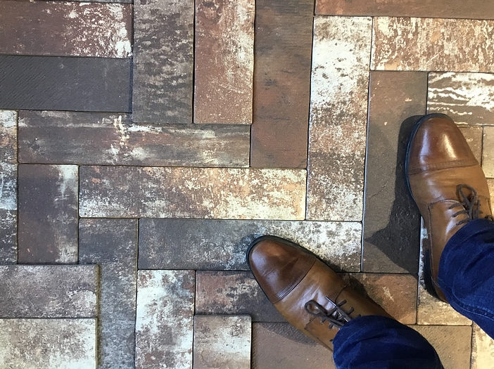 Man stands on paver tiles